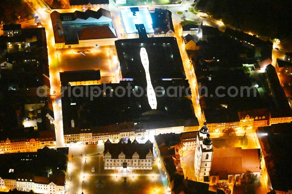 Aerial image at night Lutherstadt Wittenberg - Night lighting Building of the shopping center ARSENAL in Lutherstadt Wittenberg in the state Saxony-Anhalt