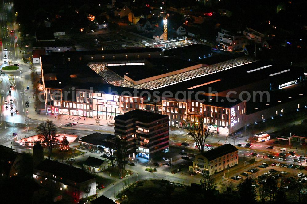 Aerial photograph at night Neumarkt in der Oberpfalz - Night lighting autumn colored vegetation view Building of the shopping center Stadtquartier Neuer Markt on Dammstrasse in the old town center in Neumarkt in der Oberpfalz in the state Bavaria, Germany