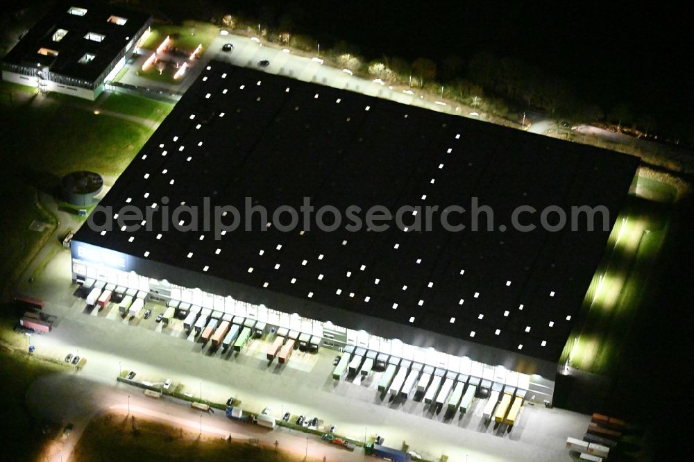 Aerial photograph at night Braak - Night lighting building of the store - furniture market of BOLTZE Gruppe GmbH on Alte Landstrasse in Braak in the state Schleswig-Holstein, Germany