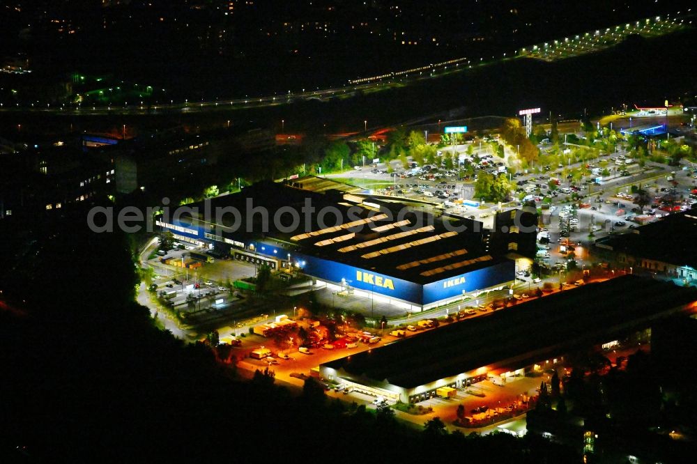 Berlin at night from the bird perspective: Night lighting building of the store - furniture market IKEA Moebel & Einrichtungshaus Berlin-Tempelhof on Sachsendonm in the district Tempelhof in Berlin, Germany