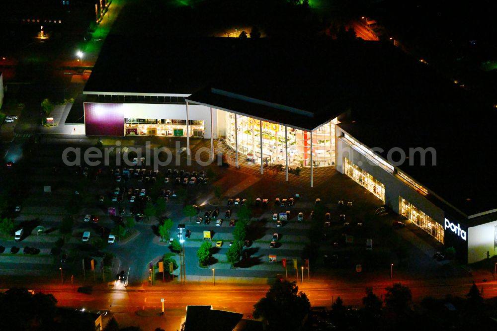 Aerial photograph at night Potsdam - Night view Building of the store - furniture market Porta Moebel in Potsdam in the state Brandenburg