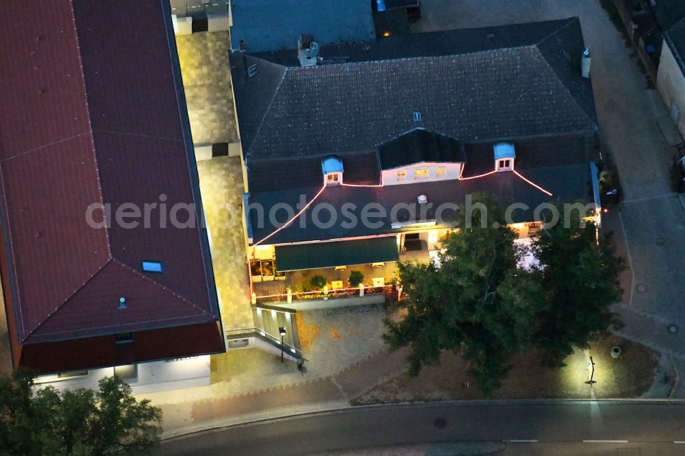 Aerial image at night Werneuchen - Night lighting Building of the restaurant Ristorante Venezia in Werneuchen in the state Brandenburg, Germany
