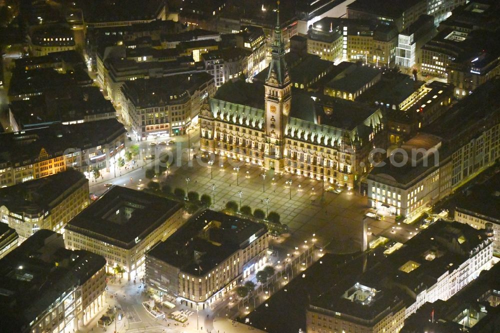 Aerial image at night Hamburg - Night lighting Town Hall building of the City Council at the market downtown in Hamburg, Germany