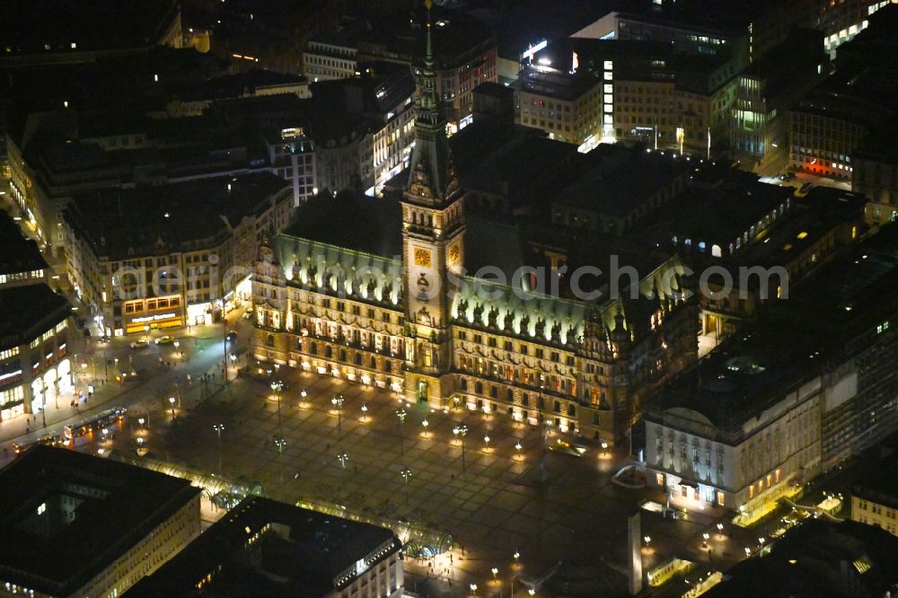 Hamburg at night from the bird perspective: Night lighting Town Hall building of the City Council at the market downtown in Hamburg, Germany