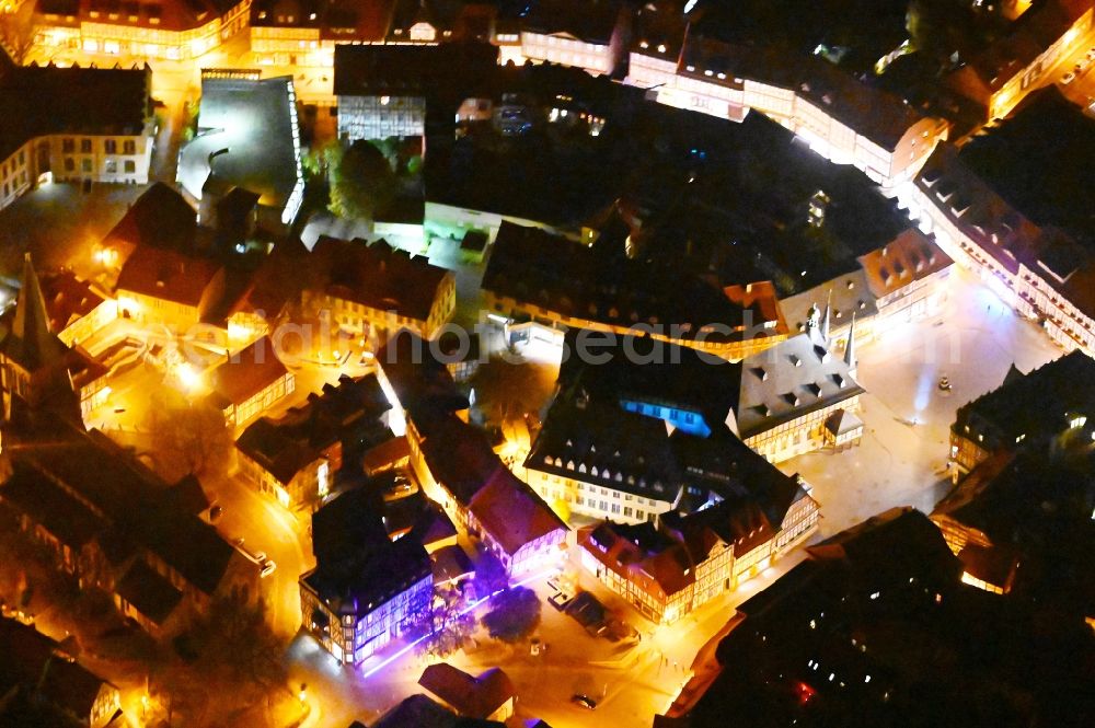 Wernigerode at night from the bird perspective: Night lighting town Hall building of the City Council at the market downtown in Wernigerode in the state Saxony-Anhalt, Germany