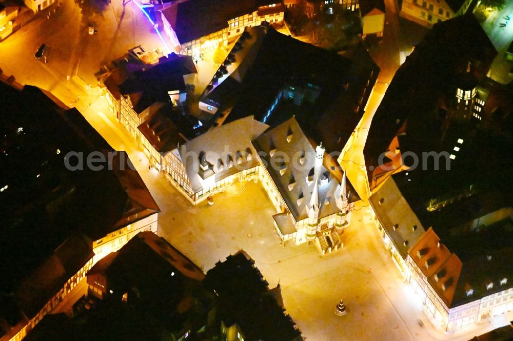 Aerial image at night Wernigerode - Night lighting town Hall building of the City Council at the market downtown in Wernigerode in the state Saxony-Anhalt, Germany