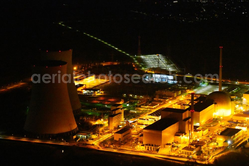 Philippsburg at night from above - Night lighting building the partly decommissioned reactor units and systems of the NPP - NPP nuclear power plant EnBW Kernkraft GmbH, Kernkraftwerk Philippsburg in Philippsburg in the state Baden-Wurttemberg, Germany