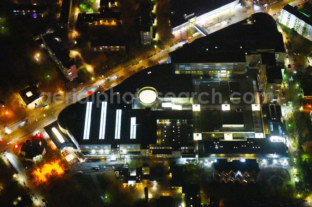 Berlin at night from above - Night lighting Building complex of the shopping mall Gropiuspassagen on Johannisthaler Chaussee in the Gropiusstadt part of the district of Neukoelln in Berlin in Germany
