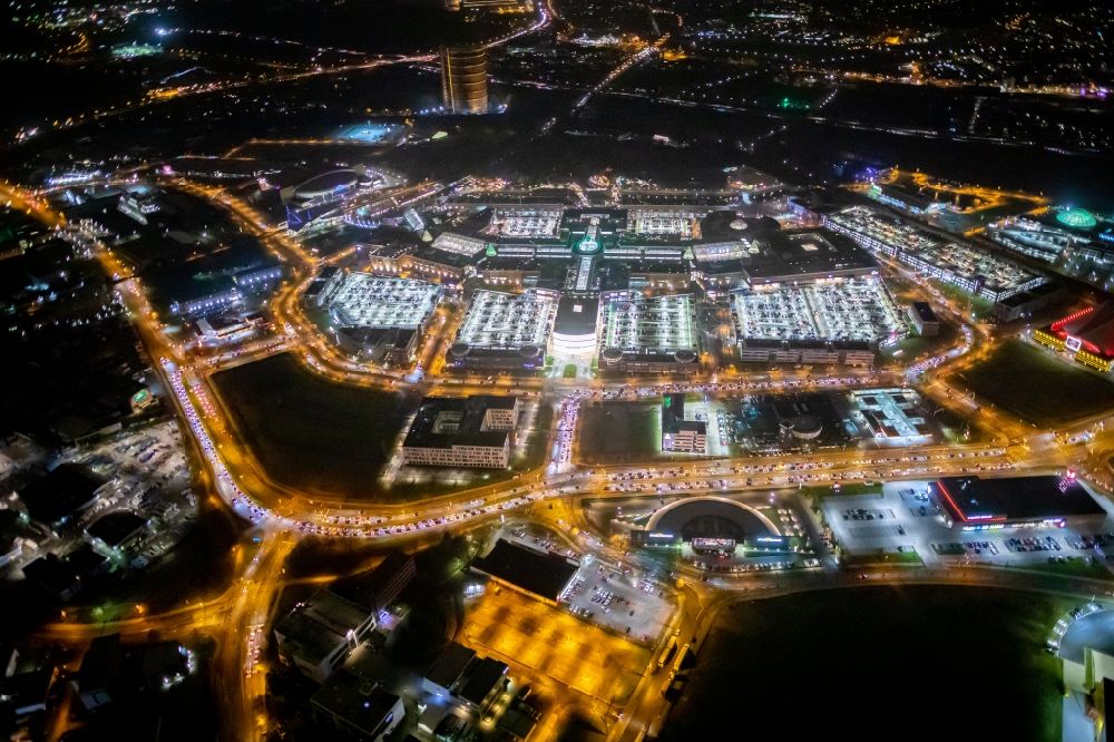 Oberhausen at night from above - Night lighting building complex of the shopping mall Centro in Oberhausen in the state of North Rhine-Westphalia. The mall is the heart of the Neue Mitte part of the city and is located on Osterfelder Strasse