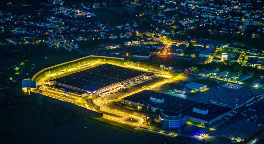 Aerial photograph at night Witten - Night lighting building complex and grounds of the logistics center with a new Amazon building on Menglinghauser Strasse - Siemensstrasse in the district Ruedinghausen in Witten at Ruhrgebiet in the state North Rhine-Westphalia, Germany