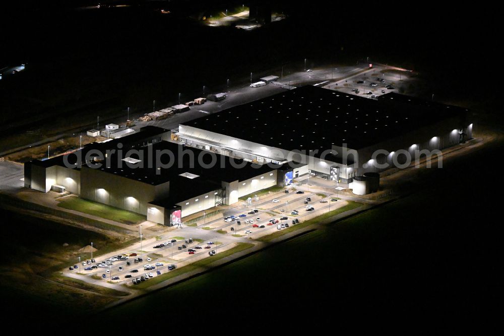 Mühlhausen at night from above - Night lighting building complex and grounds of the logistics center DEHN Logistikcenter on street Am Ludwigskanal in Muehlhausen in the state Bavaria, Germany