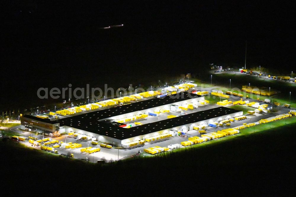 Börnicke at night from above - Night lighting Building complex and grounds of the logistics center DHL Frachtzentrum Boernicke Nord on Poststrasse in Boernicke in the state Brandenburg, Germany