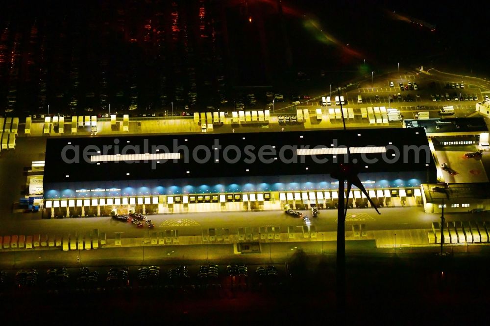 Aerial image at night Etzin - Night lighting building complex and grounds of the logistics center of Hermes Germany GmbH in Etzin in the state Brandenburg, Germany