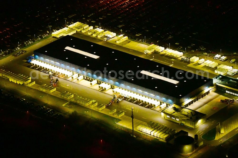 Etzin at night from above - Night lighting building complex and grounds of the logistics center of Hermes Germany GmbH in Etzin in the state Brandenburg, Germany