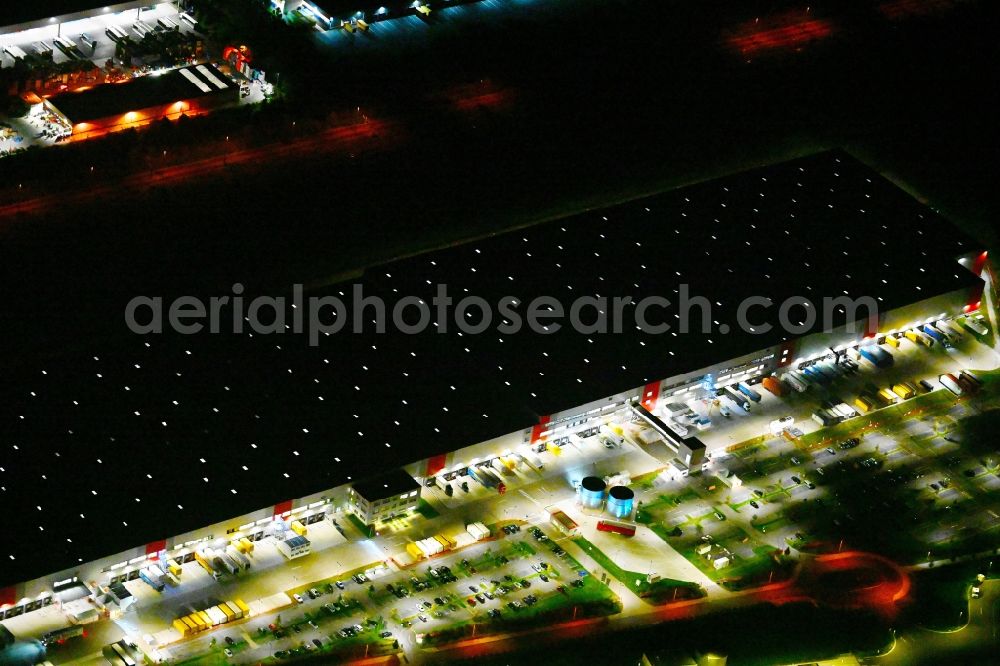 Großbeeren at night from above - Night lighting building complex and grounds of the logistics center Lidl Zentrallager An of Anhalter Bahn in the district Grossbeeren in Grossbeeren in the state Brandenburg, Germany