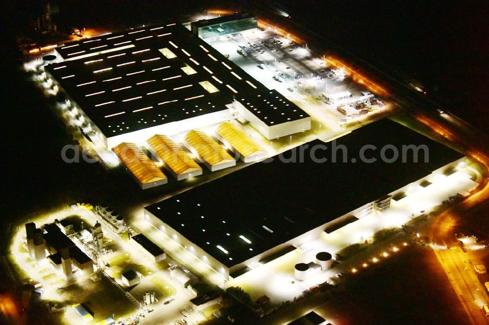 Aerial image at night Ludwigsfelde - Night lighting building complex and grounds of the logistics center of Volkswagen Original Teile Logistik GmbH & Co. KG (OTLG) in Ludwigsfelde in the state Brandenburg, Germany