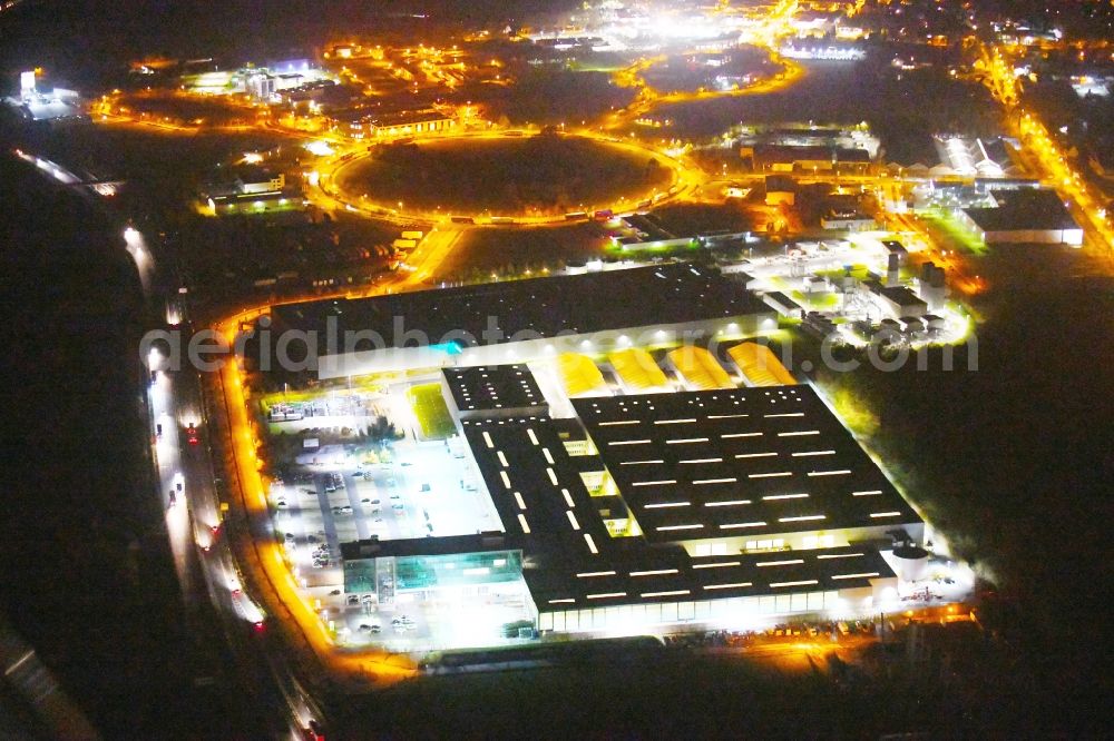 Aerial image at night Ludwigsfelde - Night lighting Building complex and grounds of the logistics center Volkswagen AG Region Ost Zum Roethepfuhl in Ludwigsfelde in the state Brandenburg, Germany