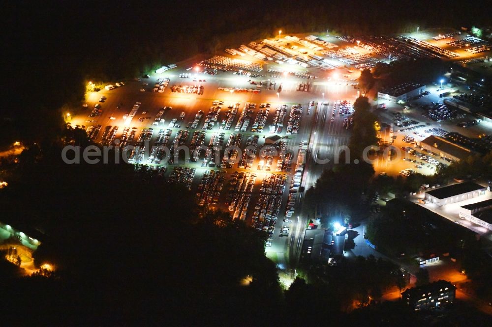 Aerial image at night Neuseddin - Night lighting building complex and grounds of the logistics center of Werner Egerland Automobillogistik GmbH & Co. KG in Neuseddin in the state Brandenburg, Germany