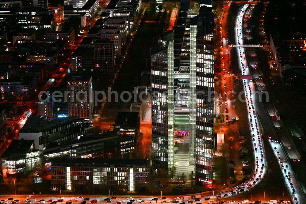 München at night from the bird perspective: Night lighting high-rise building complex HighLight Towers on corner Mies-van-der-Rohe- und Walter-Gropius-Strasse in the district Schwabing-Freimann in Munich in the state Bavaria, Germany