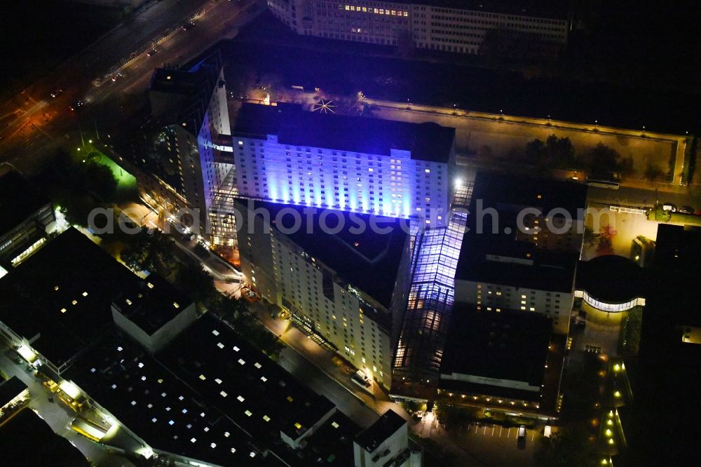 Berlin at night from above - Night lighting Complex of the hotel building Estrel Berlin in the district Neukoelln in Berlin, Germany