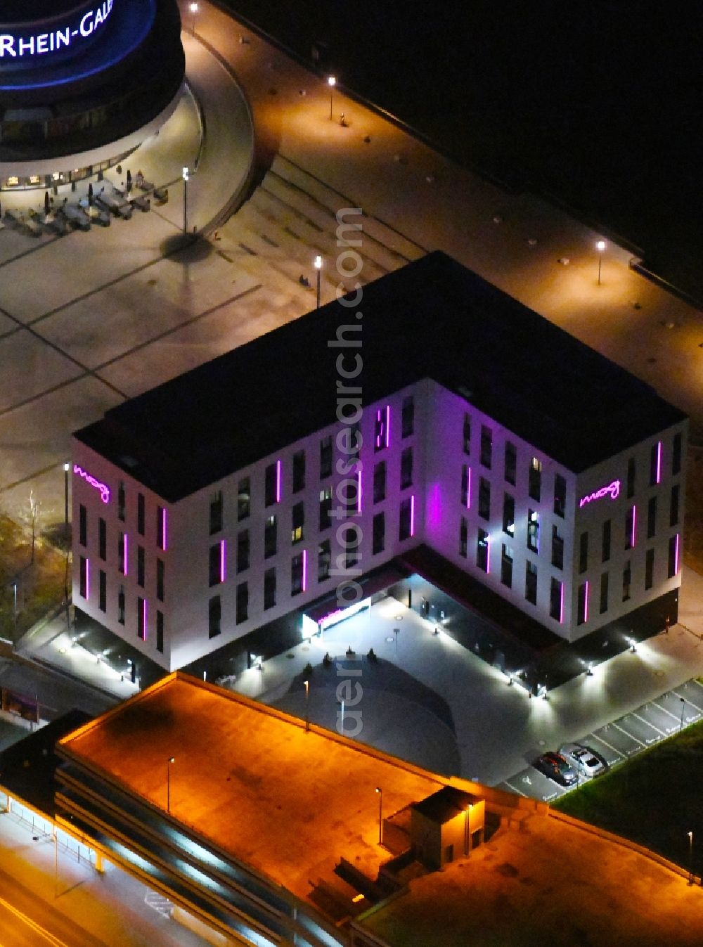 Aerial image at night Ludwigshafen am Rhein - Night lighting complex of the hotel building Moxy Ludwigshafen in Ludwigshafen am Rhein in the state Rhineland-Palatinate, Germany