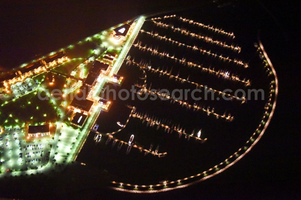 Aerial photograph at night Rostock - Night lighting Complex of buildings of the hotel arrangement Yacht harbour residence high dune in Rostock Warnemuende in the federal state Mecklenburg-West Pomerania, Germany