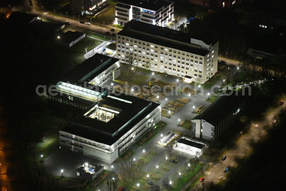 Aerial photograph at night Berlin - Night lighting building complex of the institute Chemical laboratory building of the Federal Institute for Materials Testing and Research BAM on Richard-Willstaetter-Strasse in Berlin, Germany