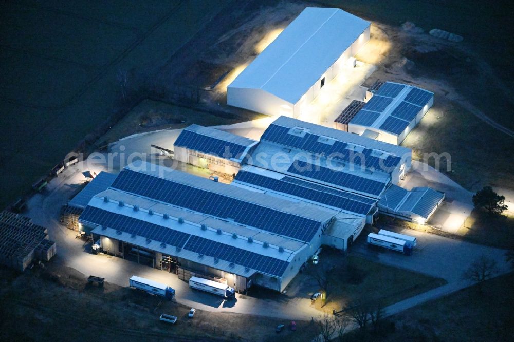 Sülte at night from above - Night lighting building complex and distribution center on the site of Agp Luebesse Agrarproduktgesellschaft mbH in Suelte in the state Mecklenburg - Western Pomerania, Germany