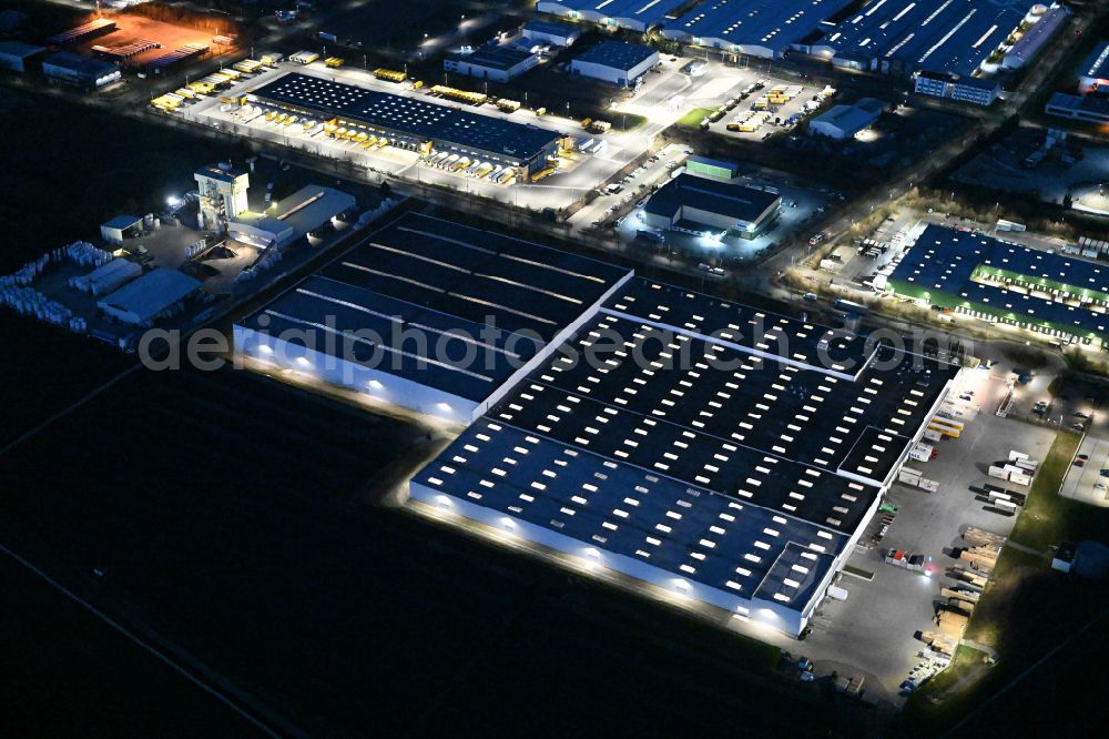 Thörey at night from above - Night lighting building complex and distribution center on the site of Carpenter GmbH on street Industriestrasse in Thoerey in the state Thuringia, Germany