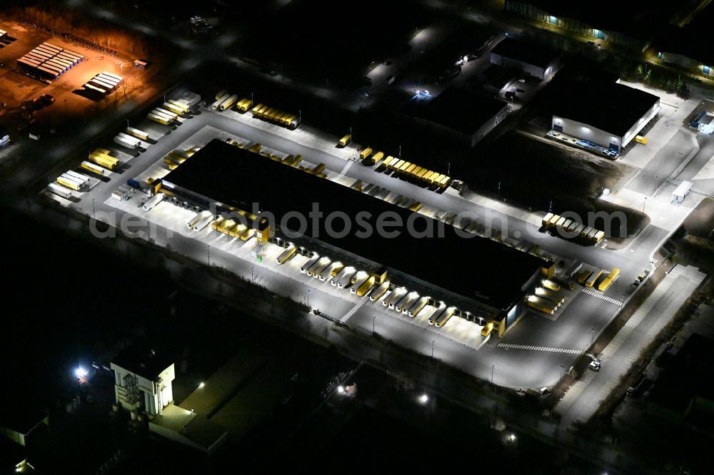 Aerial image at night Thörey - Night lighting building complex and distribution center on the site of DACHSER SE in Thoerey in the state Thuringia, Germany