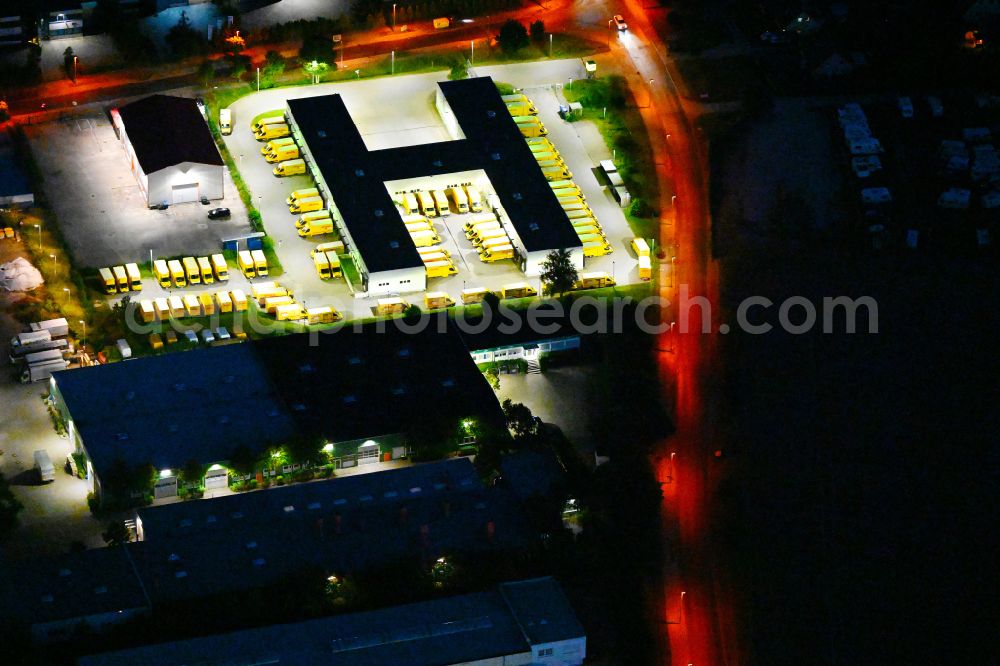Ahrensfelde at night from the bird perspective: Night lighting building complex and distribution center on the site of Deutsche Post on street Rudolf-Diesel-Strasse in Ahrensfelde in the state Brandenburg, Germany