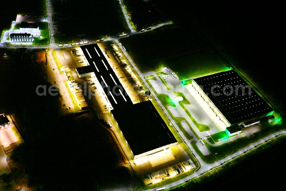 Aerial image at night Kirkel - Night lighting building complex and distribution center on the site of DSV Road GmbH in Kirkel in the state Saarland, Germany