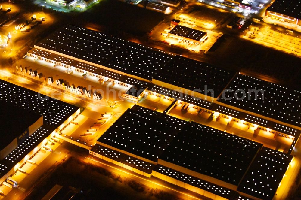 Aerial image at night Erfurt - Night lighting Building complex and distribution center on the site of IKEA Zentrallagers In of Langen Else in the district Buessleben in Erfurt in the state Thuringia, Germany
