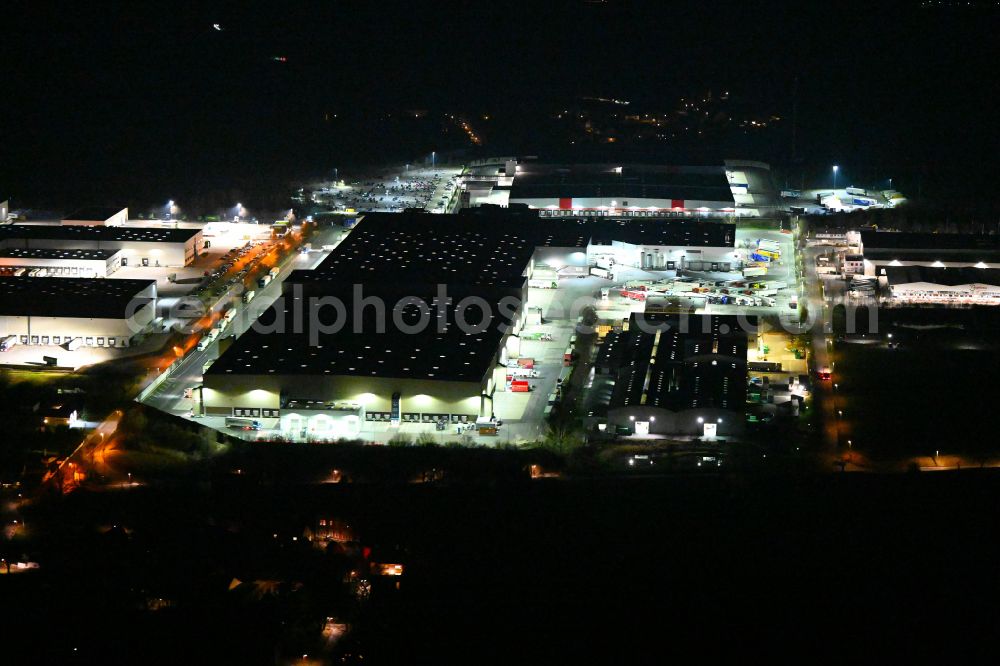 Schleinitz at night from above - Night lighting building complex and distribution center on the site Kaufland Logistik VZ GmbH & Co. KG - Osterfeld on street Kirchweg in Schleinitz in the state Saxony-Anhalt, Germany