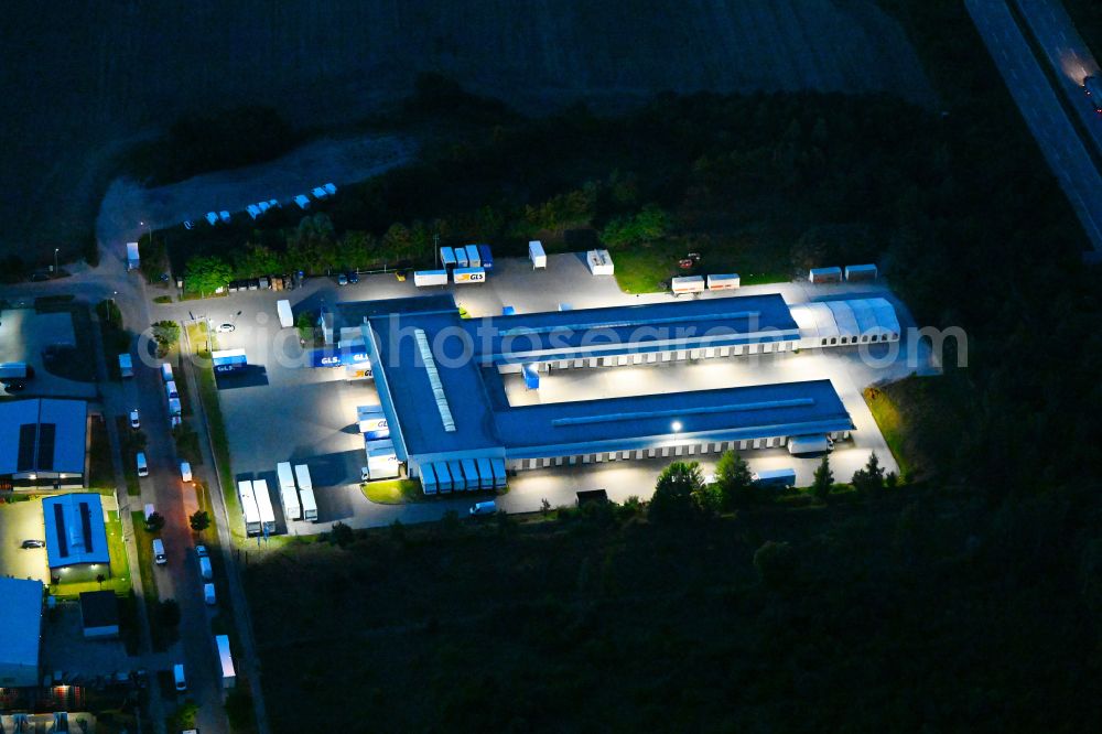 Bernau at night from above - Night lighting building complex and distribution center on the site GLS on Ringstrasse in the district Schoenow in Bernau in the state Brandenburg, Germany