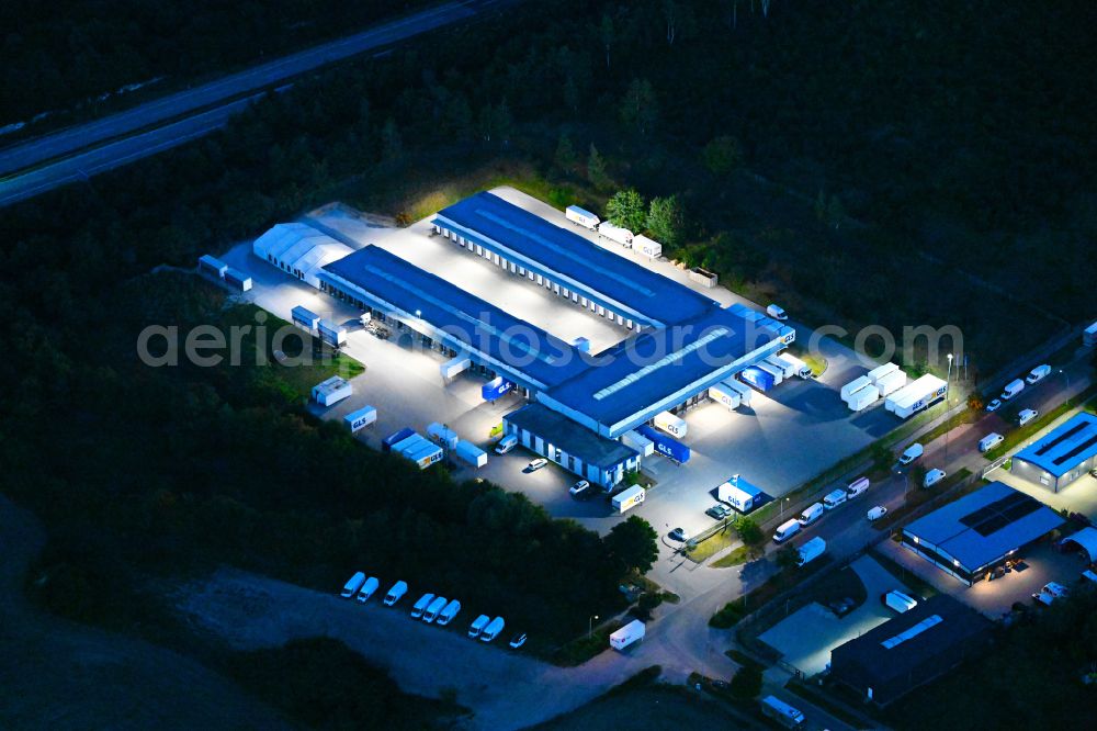 Aerial image at night Bernau - Night lighting building complex and distribution center on the site GLS on Ringstrasse in the district Schoenow in Bernau in the state Brandenburg, Germany