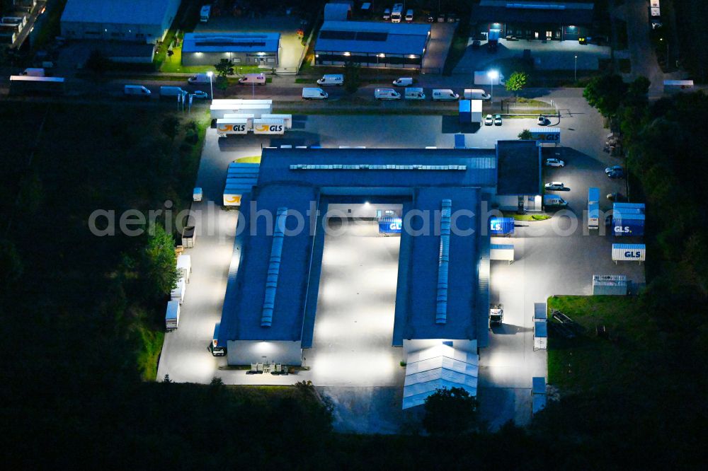 Bernau at night from above - Night lighting building complex and distribution center on the site GLS on Ringstrasse in the district Schoenow in Bernau in the state Brandenburg, Germany