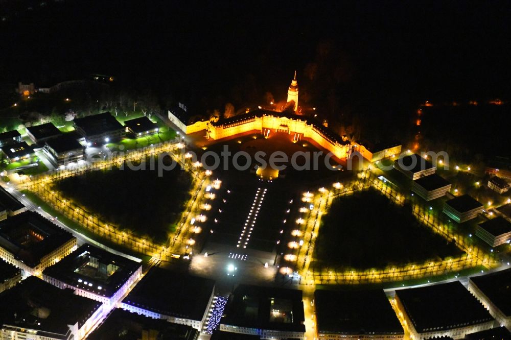 Aerial photograph at night Karlsruhe - Night lighting building complex in the park of the castle Karlsruhe overlooking the inner city in Karlsruhe in the state Baden-Wurttemberg, Germany