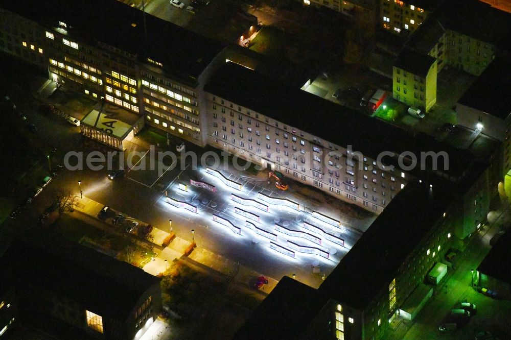 Aerial image at night Berlin - Night lighting Building complex of the Memorial of the former Stasi Ministry for State Security of the GDR in the Ruschestrasse in Berlin Lichtenberg