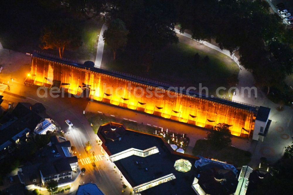 Aerial image at night Bad Rothenfelde - Night lighting Industrial monument of the technical plants and salines Altes Gradierwerk in Bad Rothenfelde in the state Lower Saxony, Germany