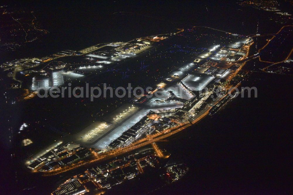 Frankfurt am Main at night from above - Night lighting runway with hangar taxiways and terminals on the grounds of the airport in Frankfurt in the state Hesse, Germany