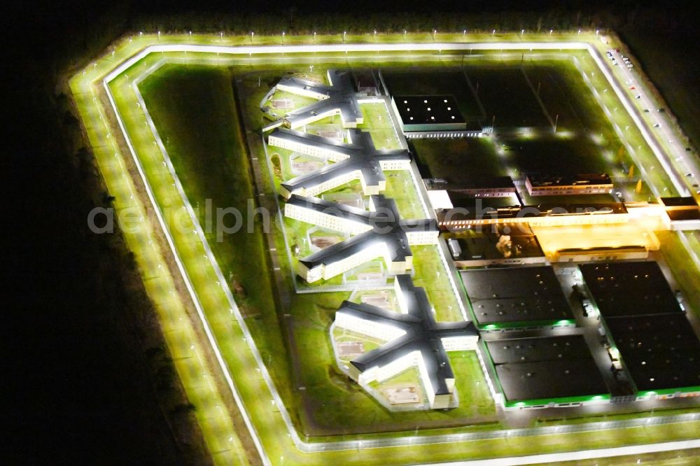Aerial image at night Burg - Night lighting prison grounds and high security fence Prison in Burg in the state Saxony-Anhalt