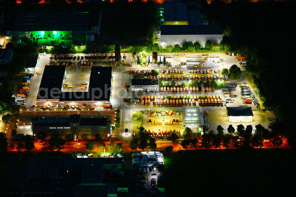 Aerial image at night Berlin - Night lighting site waste and recycling sorting BSR Recyclinghof Nordring in the district Marzahn in Berlin, Germany