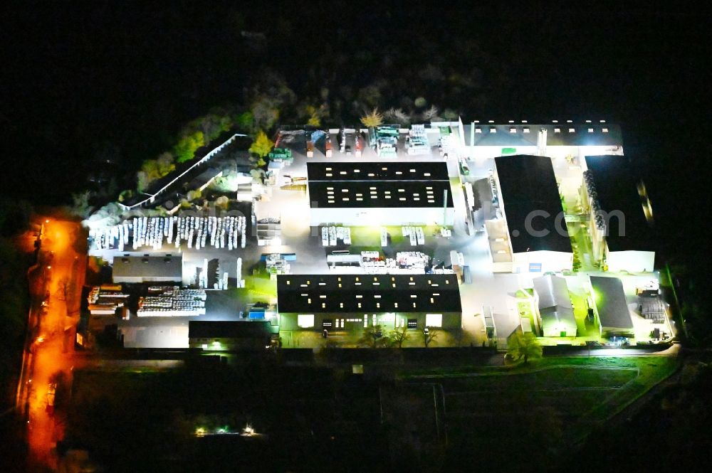 Bernburg (Saale) at night from the bird perspective: Night lighting site waste and recycling sorting of Multiport GmbH on Ernst-Grube-Strasse in Bernburg (Saale) in the state Saxony-Anhalt, Germany