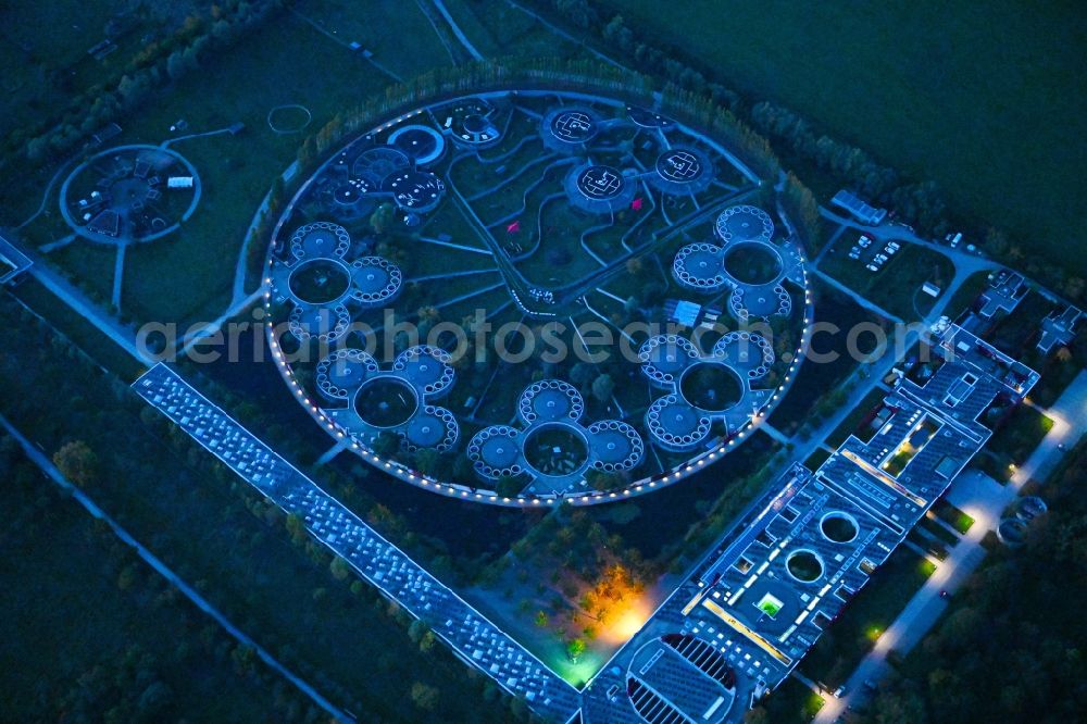 Aerial photograph at night Berlin - Night lighting site of the animal shelter, also known as the city of animals, destrict Hohenschoenhausen in Berlin in Germany