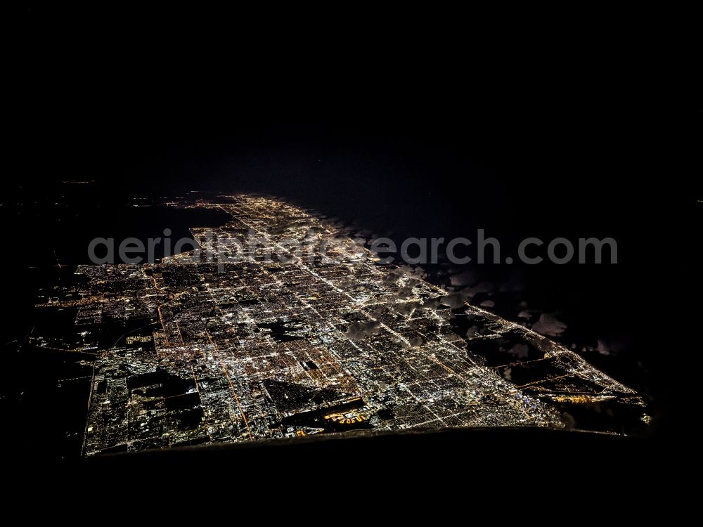 Miami at night from above - Night lighting city area with outside districts and inner city area in Miami in Florida, United States of America