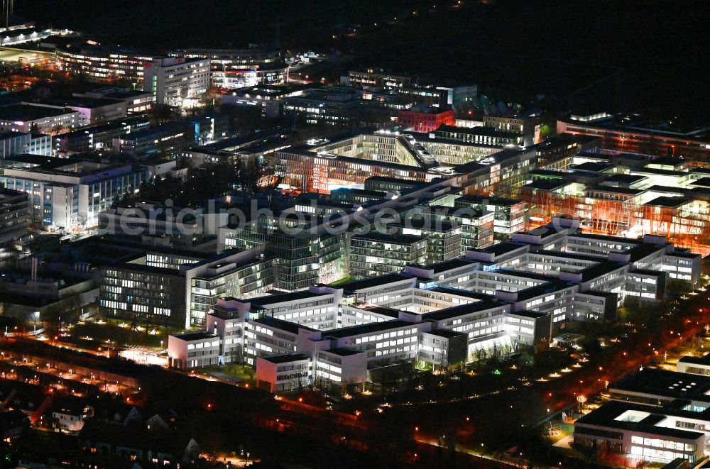 Aerial image at night Unterföhring - Night lighting office building - Ensemble of Allianz Deutschland AG on Dieselstrasse in the district Bogenhausen in Unterfoehring in the state Bavaria, Germany