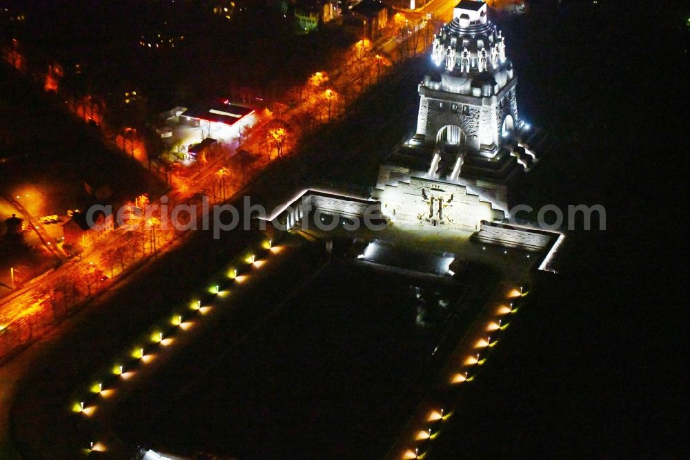 Leipzig at night from above - Night lighting Tourist attraction of the historic monument Voelkerschlachtdenkmal on Strasse of 18. Oktober in Leipzig in the state Saxony, Germany