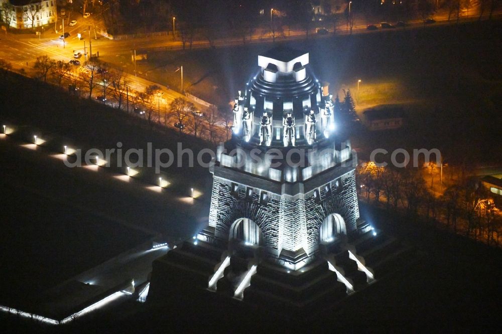 Aerial photograph at night Leipzig - Night lighting Tourist attraction of the historic monument Voelkerschlachtdenkmal on Strasse of 18. Oktober in Leipzig in the state Saxony, Germany