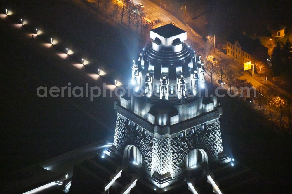 Leipzig at night from above - Night lighting Tourist attraction of the historic monument Voelkerschlachtdenkmal on Strasse of 18. Oktober in Leipzig in the state Saxony, Germany